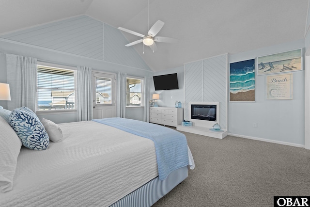 11 Pelican Watch Way Unit A/Lot11, Southern Shores, NC 27949 - bedroom featuring lofted ceiling, carpet flooring, a large fireplace, a ceiling fan, and baseboards