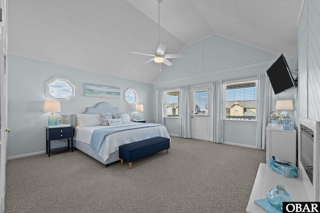 11 Pelican Watch Way Unit A/Lot11, Southern Shores, NC 27949 - bedroom with lofted ceiling, baseboards, a ceiling fan, carpet, and a textured ceiling