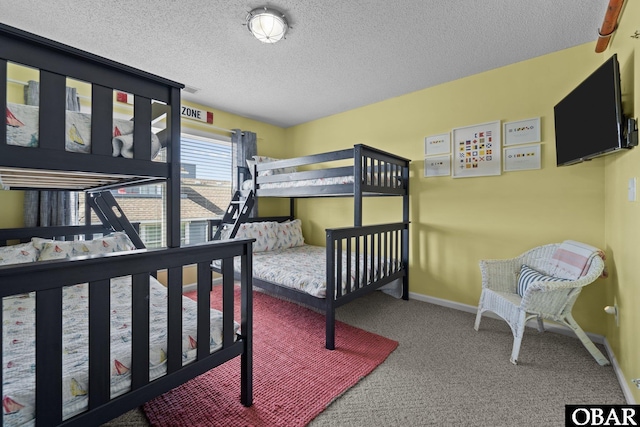 11 Pelican Watch Way Unit A/Lot11, Southern Shores, NC 27949 - bedroom featuring carpet flooring, a textured ceiling, and baseboards