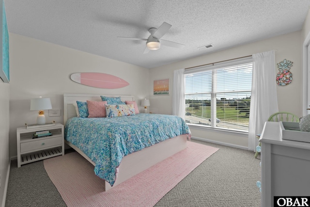 11 Pelican Watch Way Unit A/Lot11, Southern Shores, NC 27949 - carpeted bedroom with a textured ceiling, a ceiling fan, and baseboards