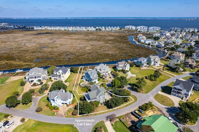 aerial view featuring a water view and a residential view