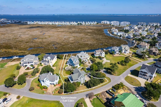 aerial view with a residential view and a water view