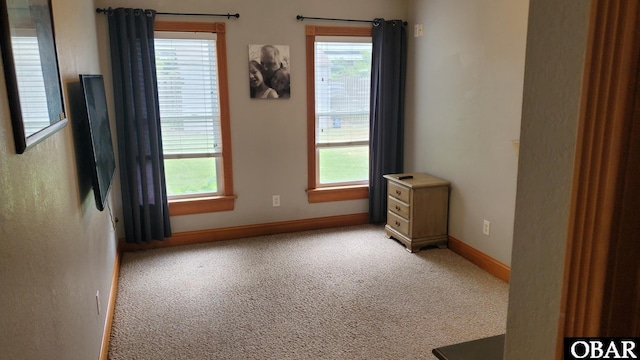 109 Golden Jubilee St Lot 9, Jarvisburg, NC 27947 - unfurnished room featuring light colored carpet, healthy amount of natural light, and baseboards
