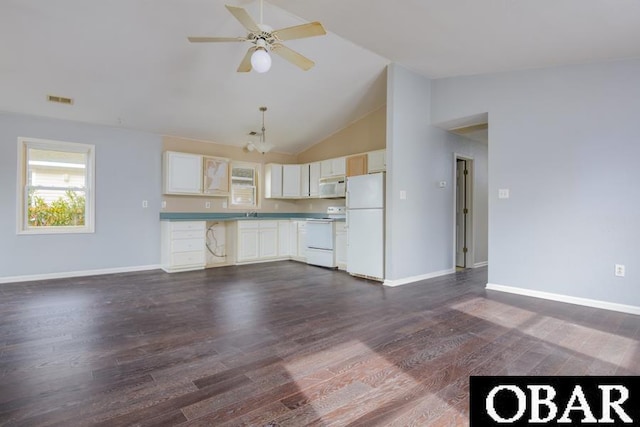 kitchen featuring white appliances, dark wood-type flooring, visible vents, open floor plan, and light countertops