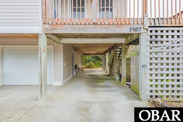 exterior space featuring a carport, driveway, and a garage