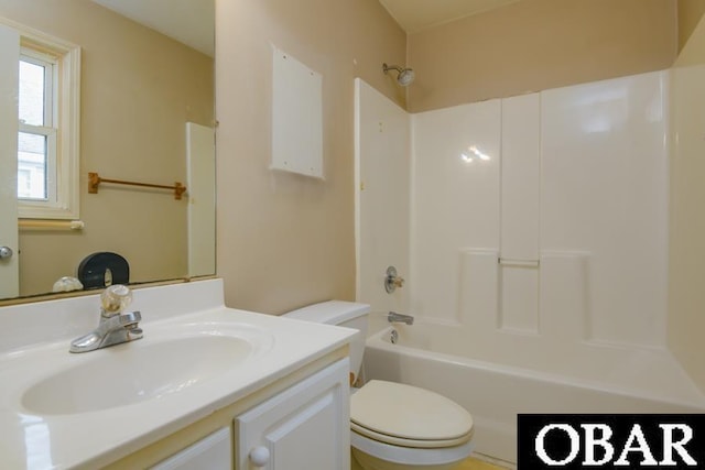 bathroom with vanity, toilet, and bathing tub / shower combination