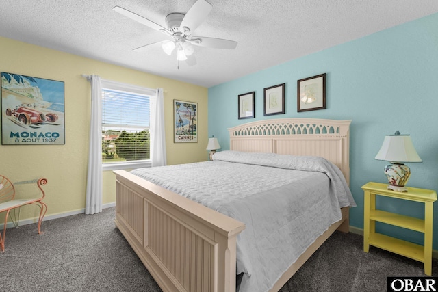 26 Pelican Watch Way Unit 2, Southern Shores, NC 27949 - carpeted bedroom featuring a textured ceiling and a ceiling fan