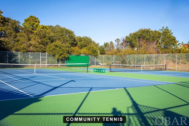 view of sport court with fence