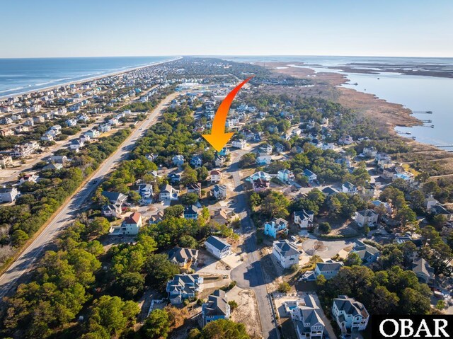 aerial view with a residential view and a water view