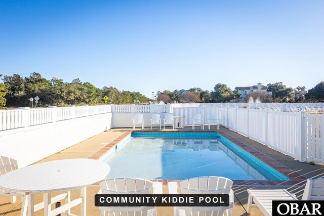 view of pool with a fenced backyard and a fenced in pool