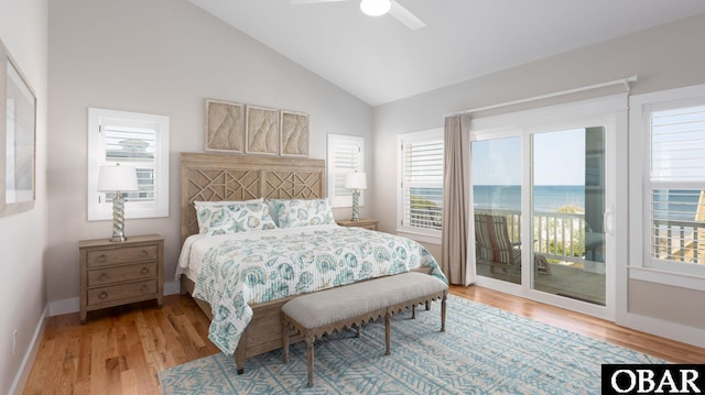 bedroom featuring baseboards, a ceiling fan, access to exterior, light wood-type flooring, and high vaulted ceiling