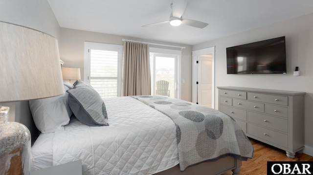 bedroom with ceiling fan and wood finished floors