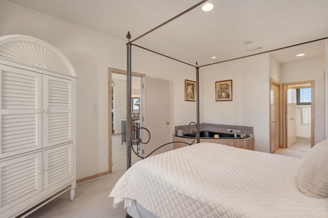 bedroom featuring baseboards and recessed lighting