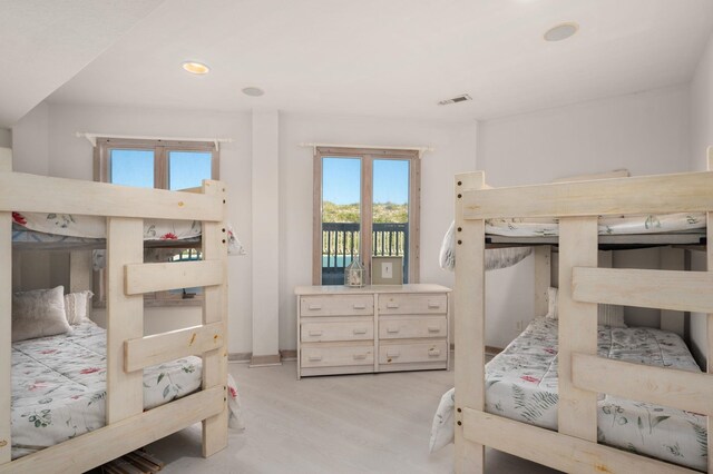 bedroom featuring visible vents, access to outside, light wood-style flooring, and recessed lighting