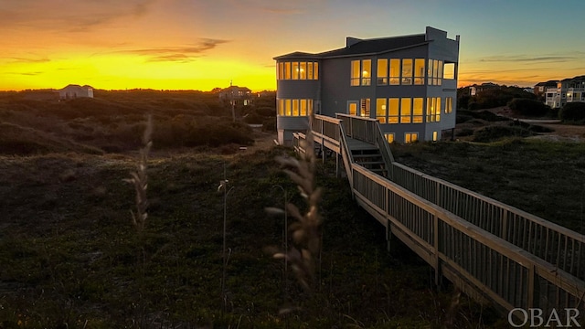 view of back of house at dusk