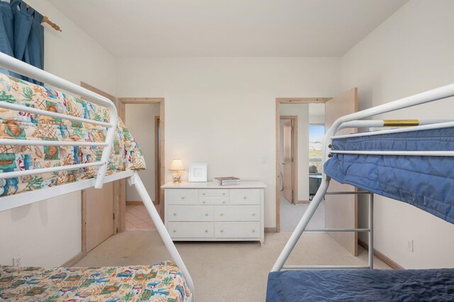 bedroom with light colored carpet