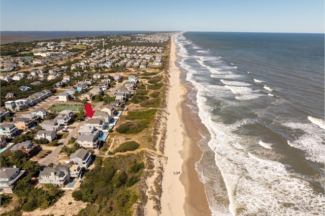 bird's eye view with a beach view, a water view, and a residential view