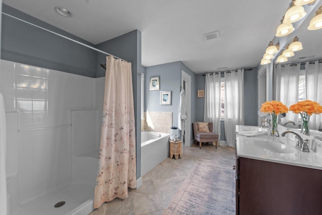 bathroom featuring double vanity, a sink, visible vents, and a shower stall