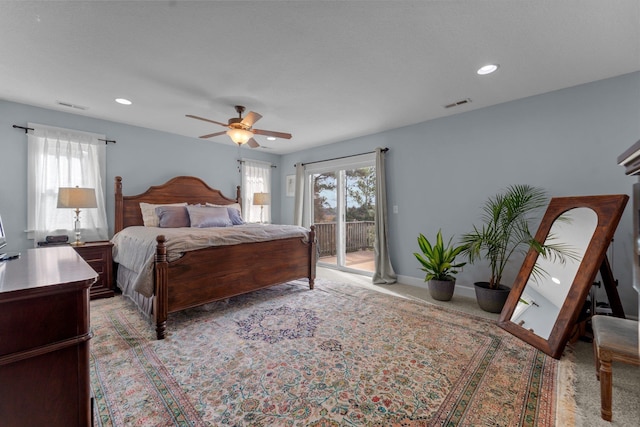 bedroom with access to exterior, visible vents, and light colored carpet