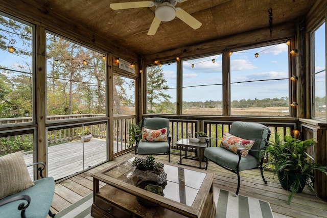 sunroom with wooden ceiling and ceiling fan