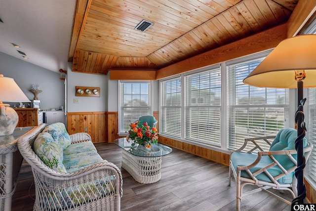 sunroom / solarium featuring lofted ceiling, wooden ceiling, and visible vents