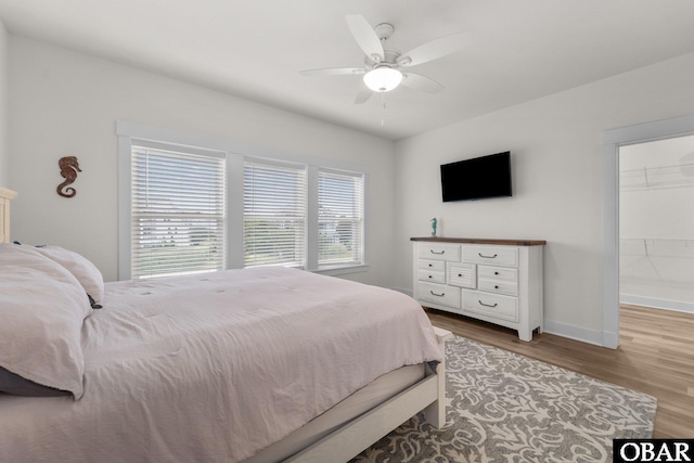 1207 Tail Wind Ct Lot 267, Corolla, NC 27927 - bedroom featuring wood finished floors, baseboards, and a ceiling fan