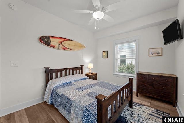 1207 Tail Wind Ct Lot 267, Corolla, NC 27927 - bedroom with wood finished floors, baseboards, and ceiling fan