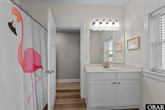 1207 Tail Wind Ct Lot 267, Corolla, NC 27927 - bathroom featuring vanity, wood finished floors, and baseboards