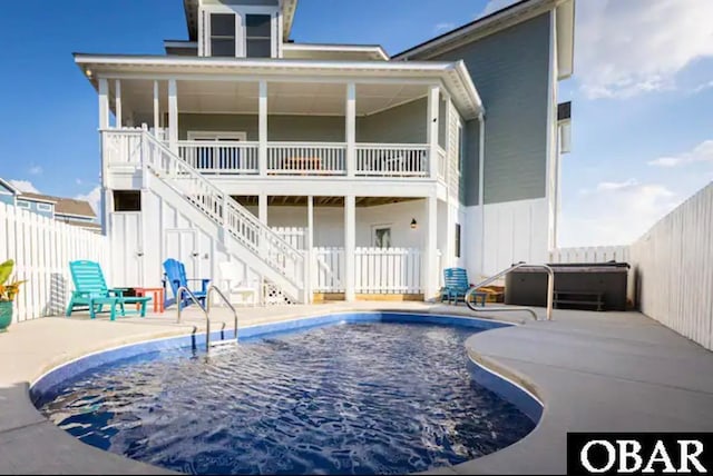 1207 Tail Wind Ct Lot 267, Corolla, NC 27927 - back of house with a fenced backyard, a patio, and stairway