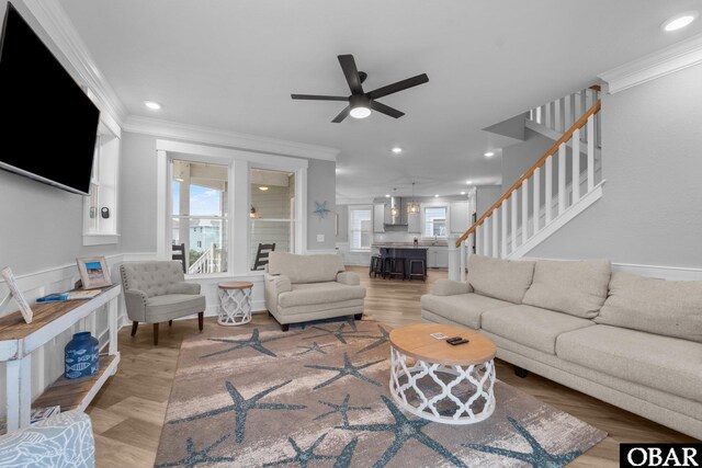 1207 Tail Wind Ct Lot 267, Corolla, NC 27927 - living room featuring crown molding, ceiling fan, stairs, light wood finished floors, and recessed lighting