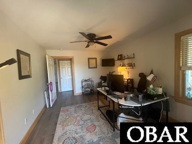 home office featuring baseboards, ceiling fan, and wood finished floors