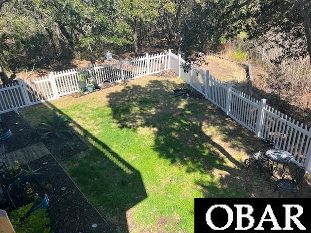 view of yard with a fenced backyard