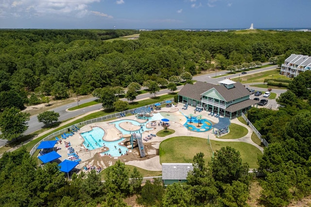 birds eye view of property with a wooded view