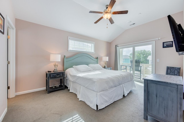 bedroom with lofted ceiling, access to outside, multiple windows, and light carpet