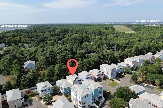 drone / aerial view with a view of trees and a residential view