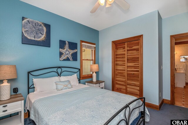 carpeted bedroom featuring a ceiling fan, baseboards, and a closet
