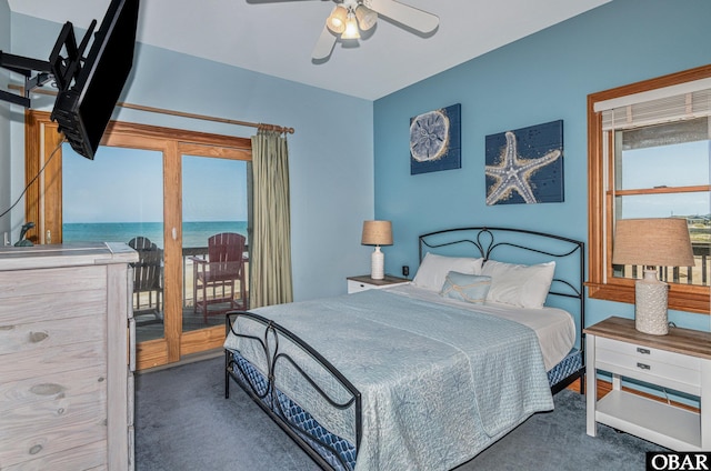 carpeted bedroom featuring access to outside and ceiling fan