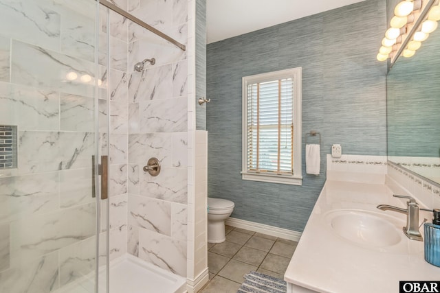 bathroom with tile patterned floors, a stall shower, toilet, and vanity