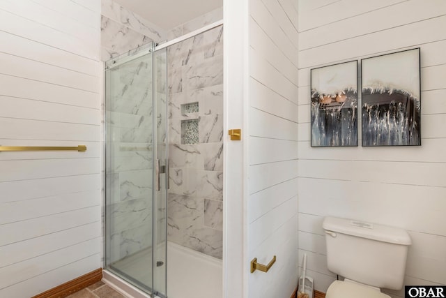 full bathroom with toilet and a stall shower