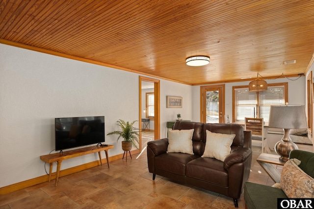 living room with baseboards, visible vents, wood ceiling, stone finish floor, and ornamental molding