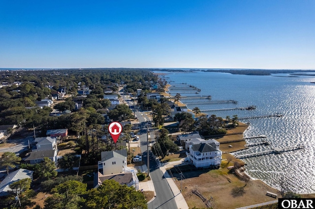 birds eye view of property with a water view and a residential view