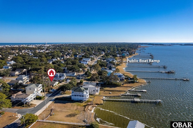 birds eye view of property with a water view and a residential view