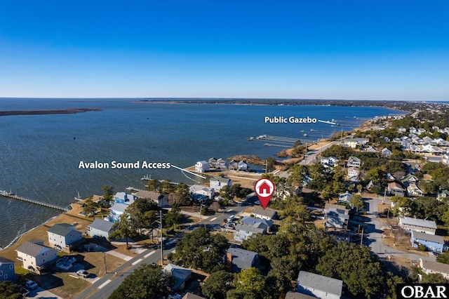 drone / aerial view featuring a water view and a residential view