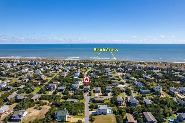 birds eye view of property with a water view and a residential view