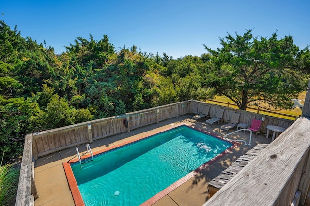 view of swimming pool featuring a fenced backyard