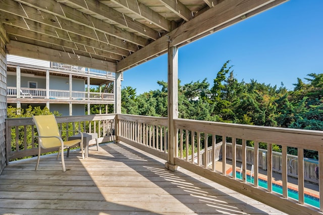 wooden deck featuring an outdoor pool