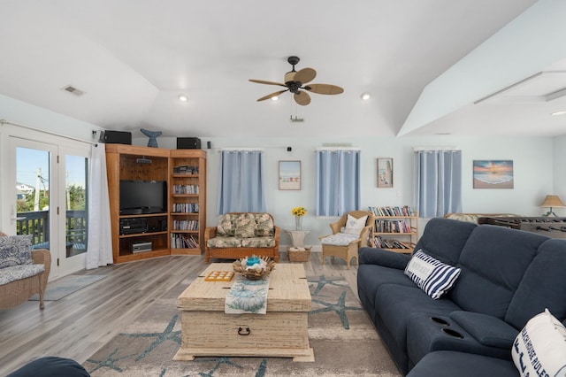 living room featuring visible vents, a ceiling fan, lofted ceiling, light wood-style floors, and recessed lighting