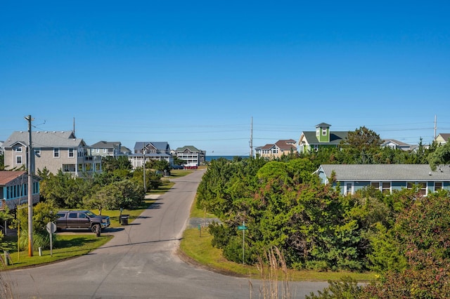 view of road with a residential view