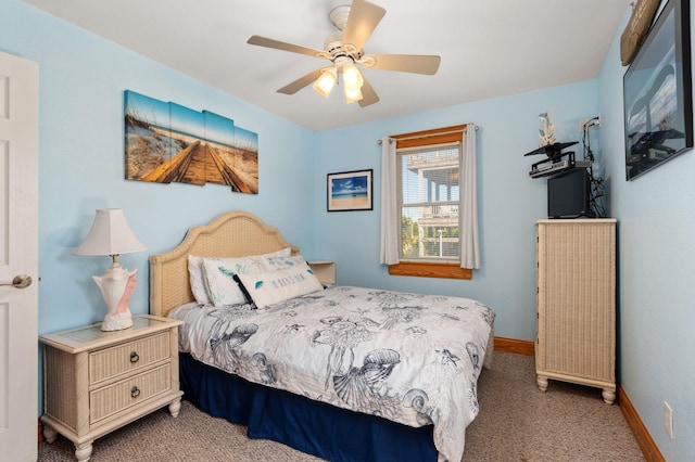 carpeted bedroom with baseboards and a ceiling fan