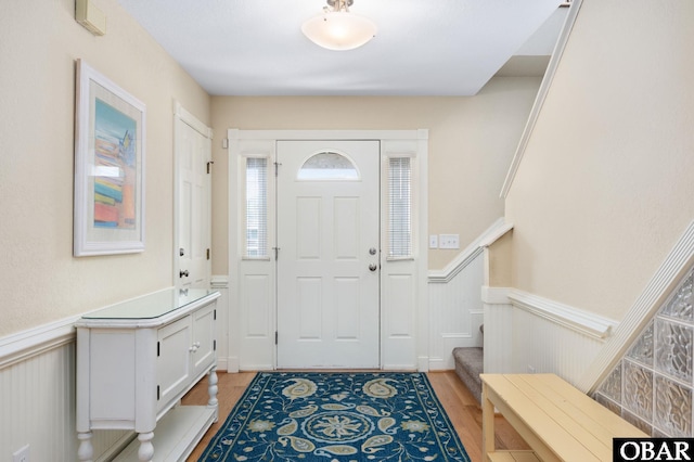 5001 S Virginia Dare Trl Lot 25, Nags Head, NC 27959 - foyer entrance featuring wainscoting, stairs, and light wood finished floors